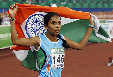 India's Kavita Raut celebrates after claiming the bronze medal in the 10,000 metres event on Friday
