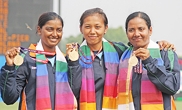 Indian archers Dola Banerjee, Deepika Kumari and Bombayala Devi (women's team recurve), with their gold medals at the  presentation ceremony on Friday