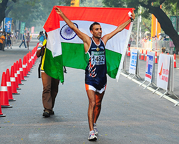 Harminder Singh celebrates after claiming the bronze medal