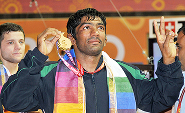Yogeshwar Dutt celebrates after winning the gold medal in (men's) 60Kg freestyle wrestling on Saturday