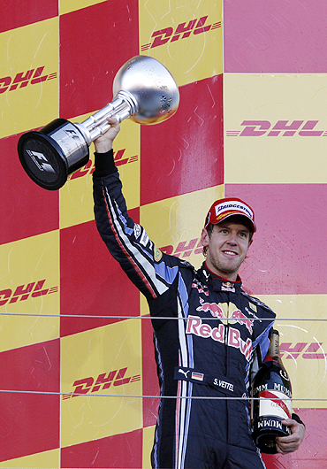 Sebastian Vettel celebrates after winning the Japanese GP