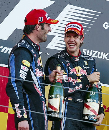 Red Bull's Sebastian Vettel (right) and team-mate Mark Webber celebrate on the podium