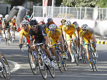 Cyclists compete in the men's road race cycling event on Sunday