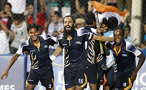 The Indian hockey team celebrates after beating England