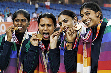 India's Sini Jose (left), Mandeep Kaur (2nd from left), Manjeet Kaur and Ashwini (right) with their gold medals after winning the women's 4x400 metres event on Tuesday