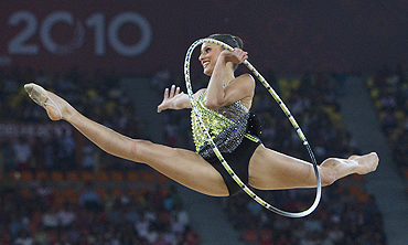 Australia's Naazmi Johnson competes with the hoop during her gold medal performance in the rhythmic gymnastics event on Wednesday