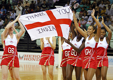 England players celebrate after defeating Jamaica in their women's netball bronze medal match on Thursday