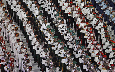 Indian soldiers play musical instruments during the Commonwealth Games closing ceremony