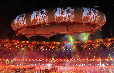 Performers participate under the aerostat during the Commonwealth Games closing ceremony
