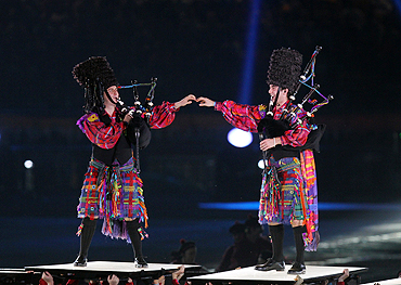 Scottish performers play bagpipes at the closing ceremony