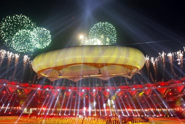 Fireworks explode over the Jawaharlal Nehru stadium during the Commonwealth Games closing ceremony