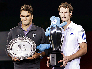 Andy Murray and Roger Federer with their trophies 
