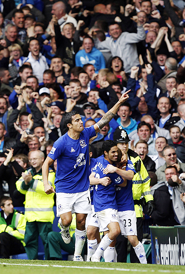 Tim Cahill celebrates after scoring against Liverpool on Sunday