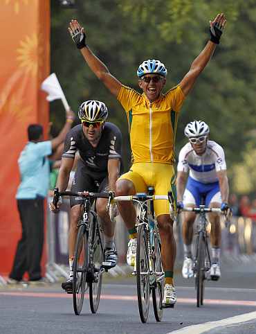 Australia's Allan Davis celebrates after crossing the finish to win the gold medal