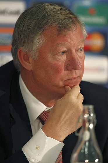 Alex Ferguson reads a statement about the future of Wayne Rooney following a news conference at Old Trafford