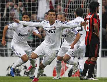 Cristiano Ronaldo reacts after scoring against AC Milan