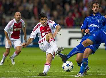 Ajax Amsterdam's Luis Suarez shoots during their Champions League match