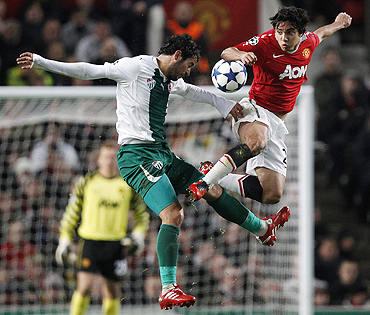 Manchester United's Rafael (right) challenges Bursaspor's Ozan Ipek