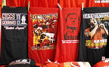 T-shirts depicting Wayne Rooney and Alex Ferguson are sold on a street stall before Manchester United's Champions League match against Bursaspor at Old Trafford on Wednesday