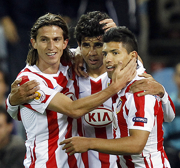 Atletico Madrid's Diego Costa (centre) celebrates with teammates Filipe (left) and Sergio Aguero after scoring against Rosenborg