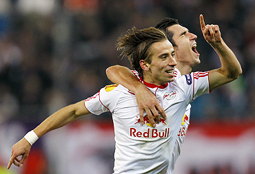 Salzburg's Dusan Svento (left) celebrates with teammate Nikola Pokrivac after scoring against Juventus
