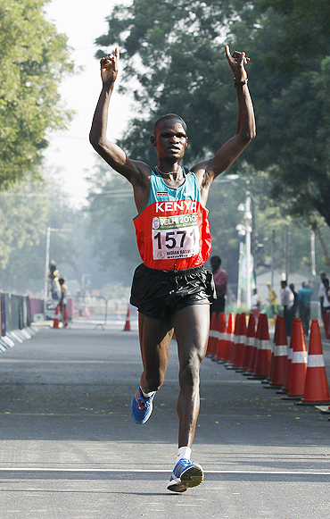 Kenya's John Kelai celebrates after winning the men's marathon at the 2010 Commonwealth Games.