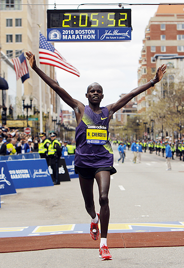 Kenya's Robert Kiprono Cheruiyot crosses the finish line to win the Boston Marathon on April 19.