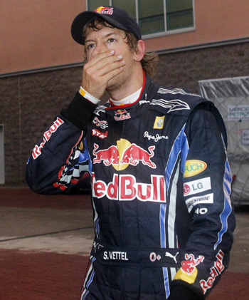 Red Bull Formula One driver Sebastian Vettel of Germany reacts in the paddock after he retired from the South Korean F1 Grand Prix