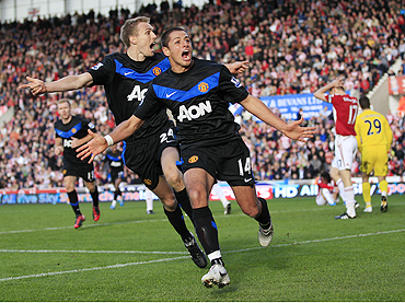 Manchester United's Javier Hernandez (right) celebrates his second goal against Stoke City with Darren Fletcher on Sunday