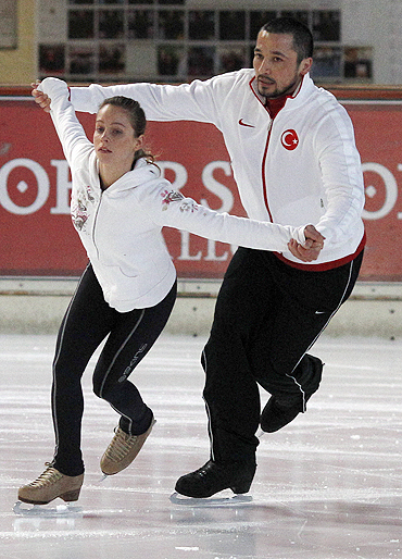 Ilhan Mansiz, former soccer player of the Turkish national team and his girlfriend Olga Bestandigova practice figure skating