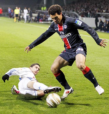 Olympique Lyon's Jeremy Pied (left) challenges Ceara of Paris St Germain