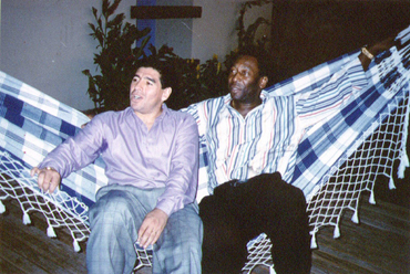 Pele and Diego Maradona sit together at a reception in Rio de Janeiro on May 14, 1995