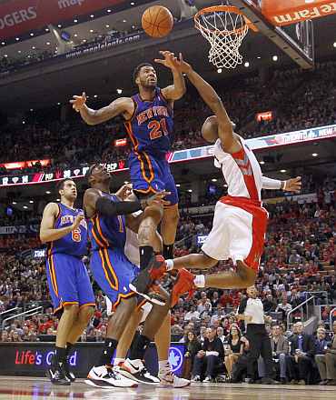 Toronto Raptors' Jarrett Jack jumps in the air against New York Knicks' Wilson Chandler (21) during their NBA basketball game