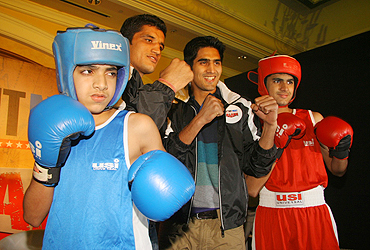 Dinesh Kumar and Vijender Singh with young boxers Moin Darvesh (right) and Owais Darvesh