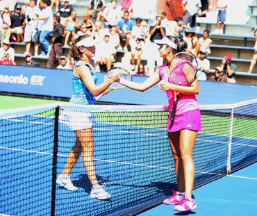 Sania Mirza (right) greets Michelle Larcher de Brito after winning her first round match on Monday