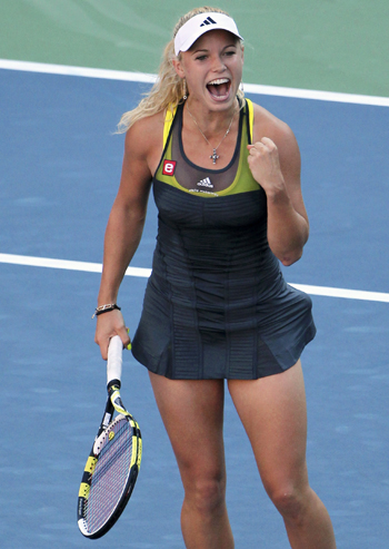 Caroline Wozniacki of Denmark celebrates her victory against Maria Sharapova of Russia at the U.S. Open