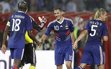 Karim Benzema celebrates with team-mates after scoring against Bosnia