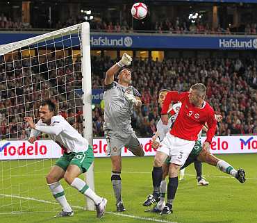 Portugal's goalkeeper Eduardo tries to save a ball during their Euro 2012 qualifying match against Norway