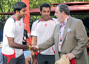 Pakistan's ambassador to the UN, Abdullah Haroon (right) greets Indian tennis player Rohan Bopanna as Pakistan player Aisam Qureshi looks on, in New York on Thursday