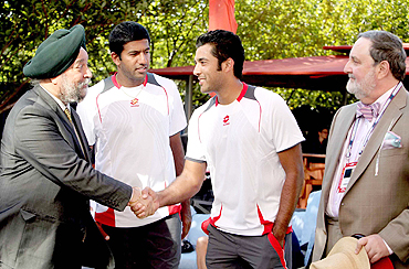India's ambassador to the UN, Hardeep Puri (left) greets Aisam Qureshi, as Bopanna and Abdullah Haroon look on, in New York on Thursday