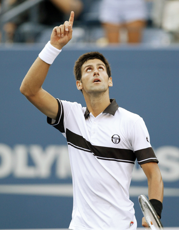 Novak Djokovic of Serbia celebrates his victory against Gael Monfils of France