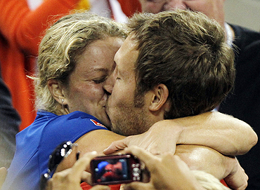 Kim Clijsters  kisses her husband Brian Lynch after winning the US Open final