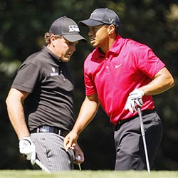 Phil Mickelson (left) with Tiger Woods