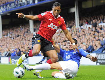 Everton's Tim Cahill (right) and Manchester United's Nani vie for possession