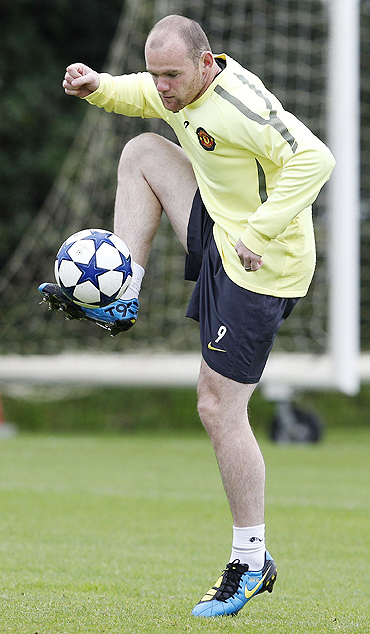 Wayne Rooney goes through the grind at a training session on Monday