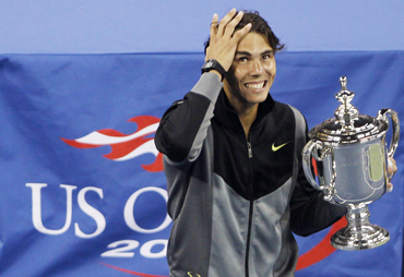 Rafael Nadal of Spain celebrates with his trophy after his victory against Novak Djokovic of Serbia