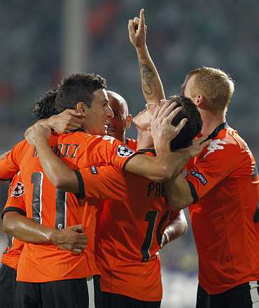 Valencia's players celebrate after their goal against Bursaspor