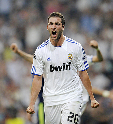 Real Madrid's Gonzalo Higuain celebrates after scoring his second goal against Ajax on Wednesday