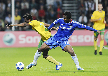 Zilina's Babatounde Bello (left) and Chelsea's John Obi Mikel vie for possession during their match on Wednesday