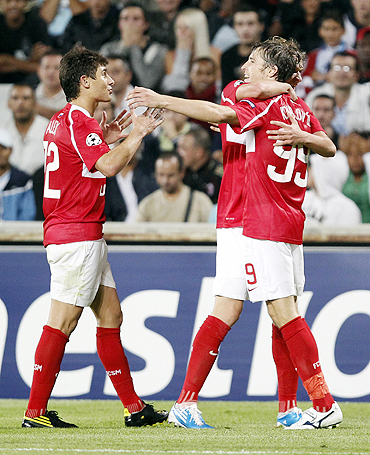 Spartak Moscow's Dmitri Kombarov (right) celebrates with teammates after scoring against Olympique Marseille